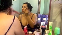 Cute Girl Sexy Makeup in the Mirror and Gently Massages Her Boobs